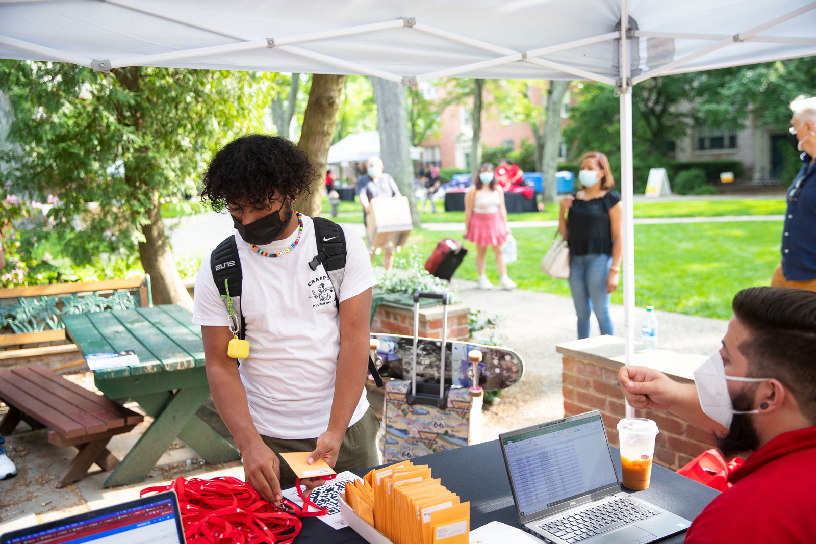 A student checks in at the registration table before moving into their dormitory room, officially kicking off their Summer@Brown experience.