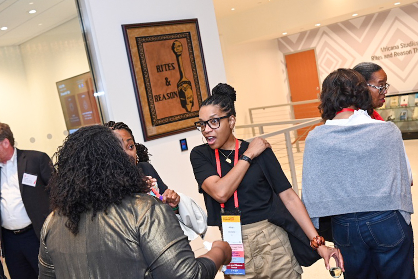 Attendees gather and laugh in the new churchill house lobby