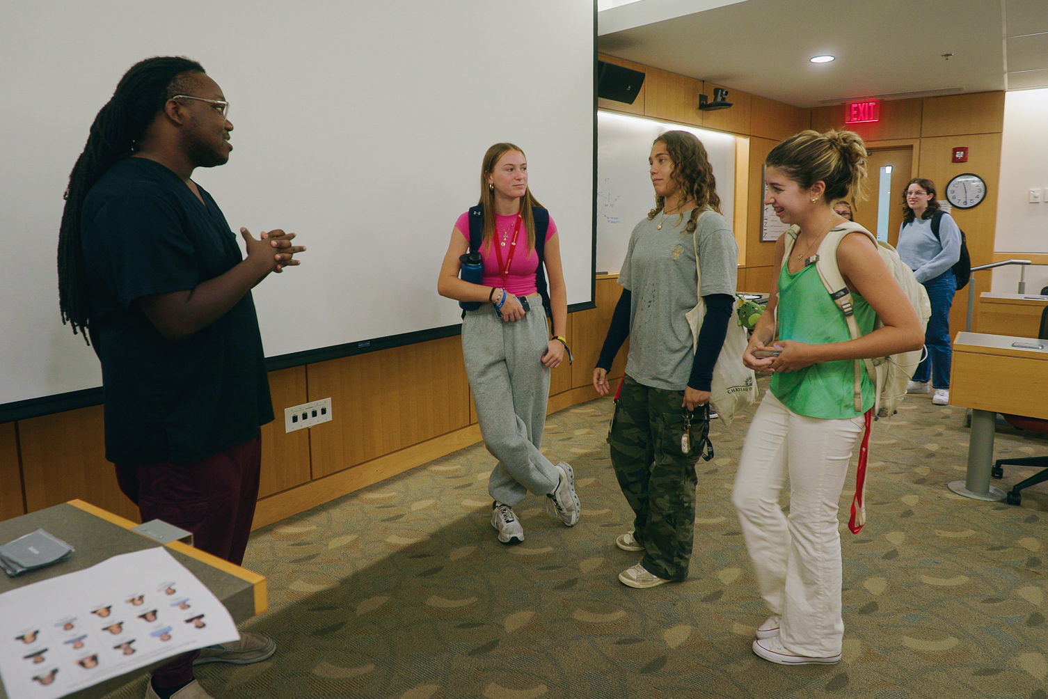 Jai Chavis chats with students after class