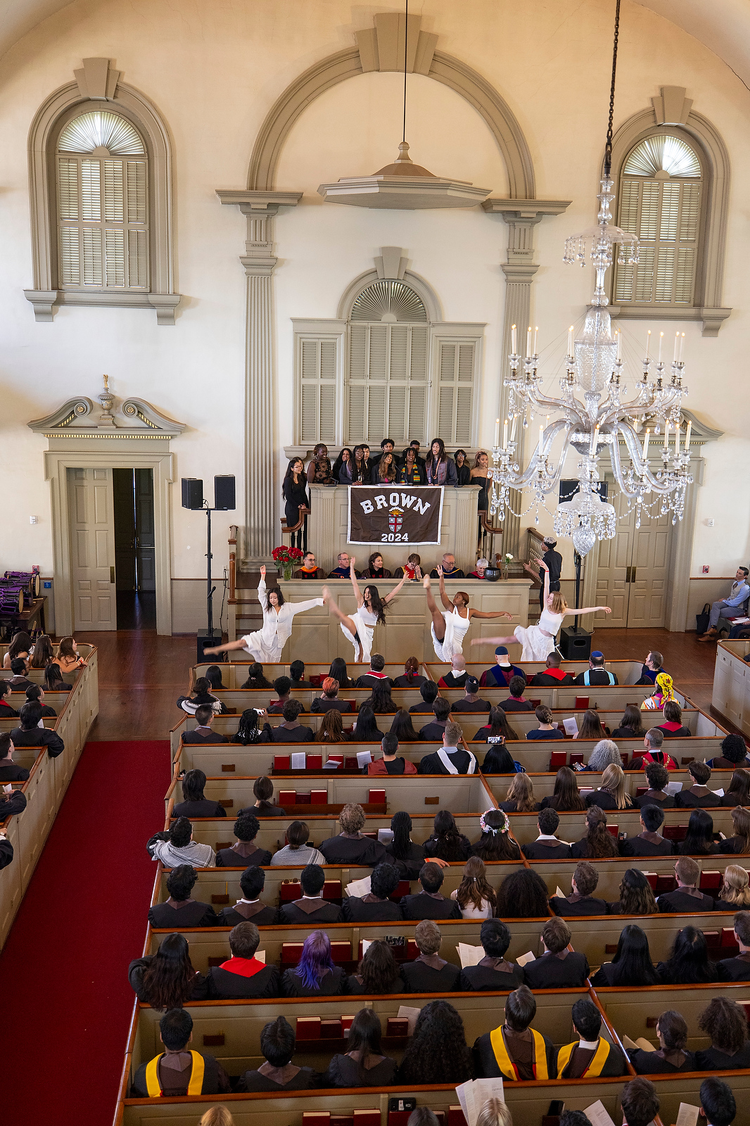 Students dance during a cappella performance