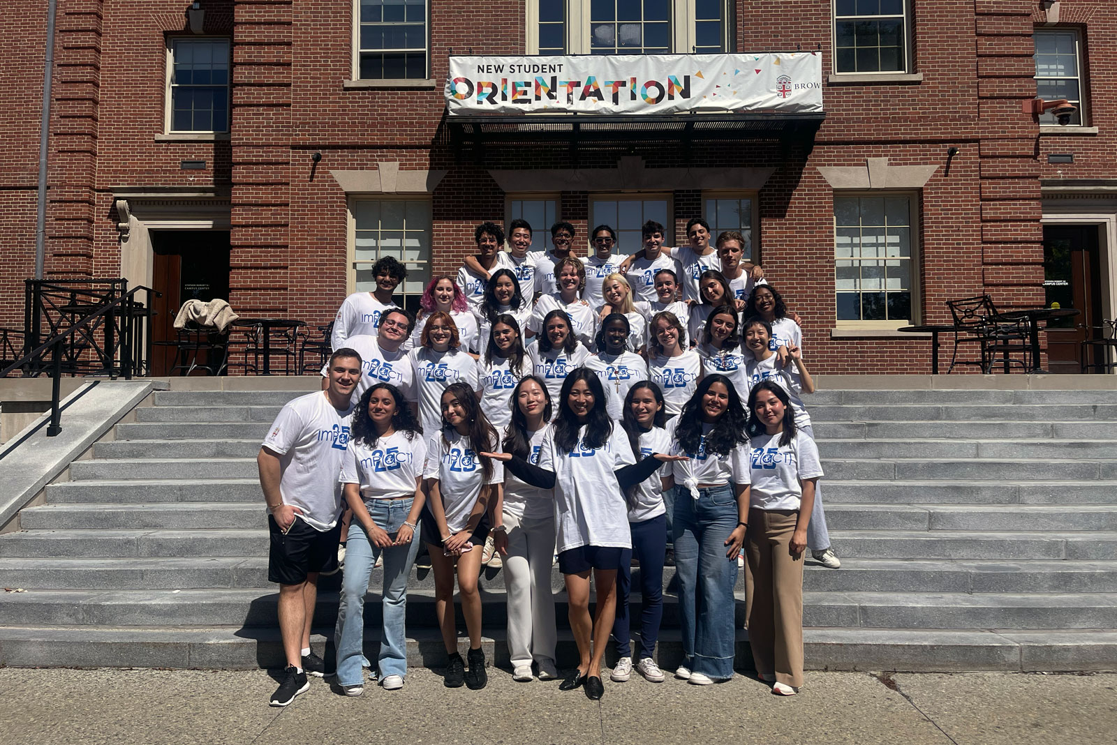 IMP mentors stand in front of campus center