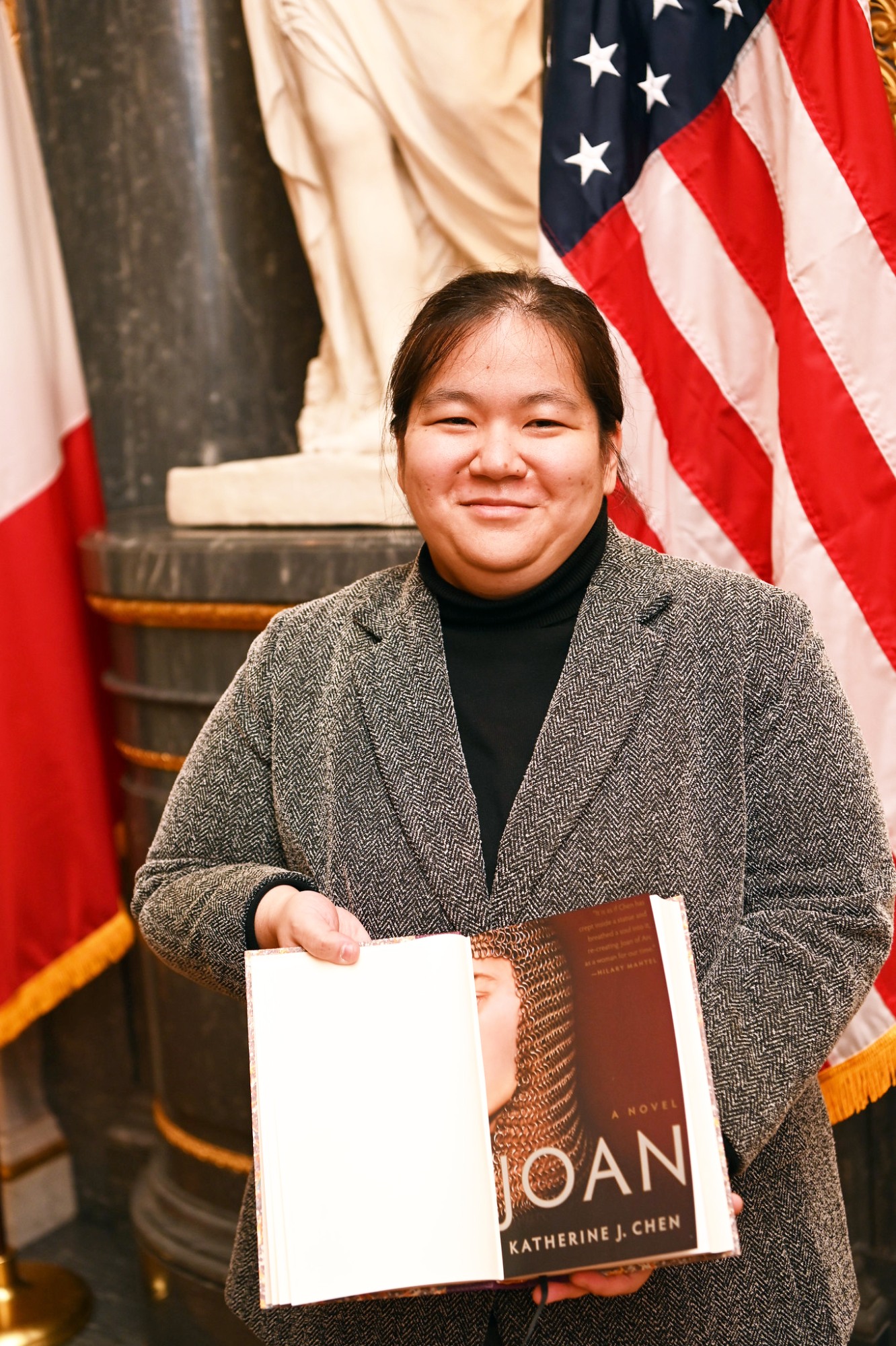 Katherine Chen holds her book "Joan"