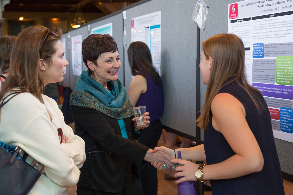 Wetle with students at poster