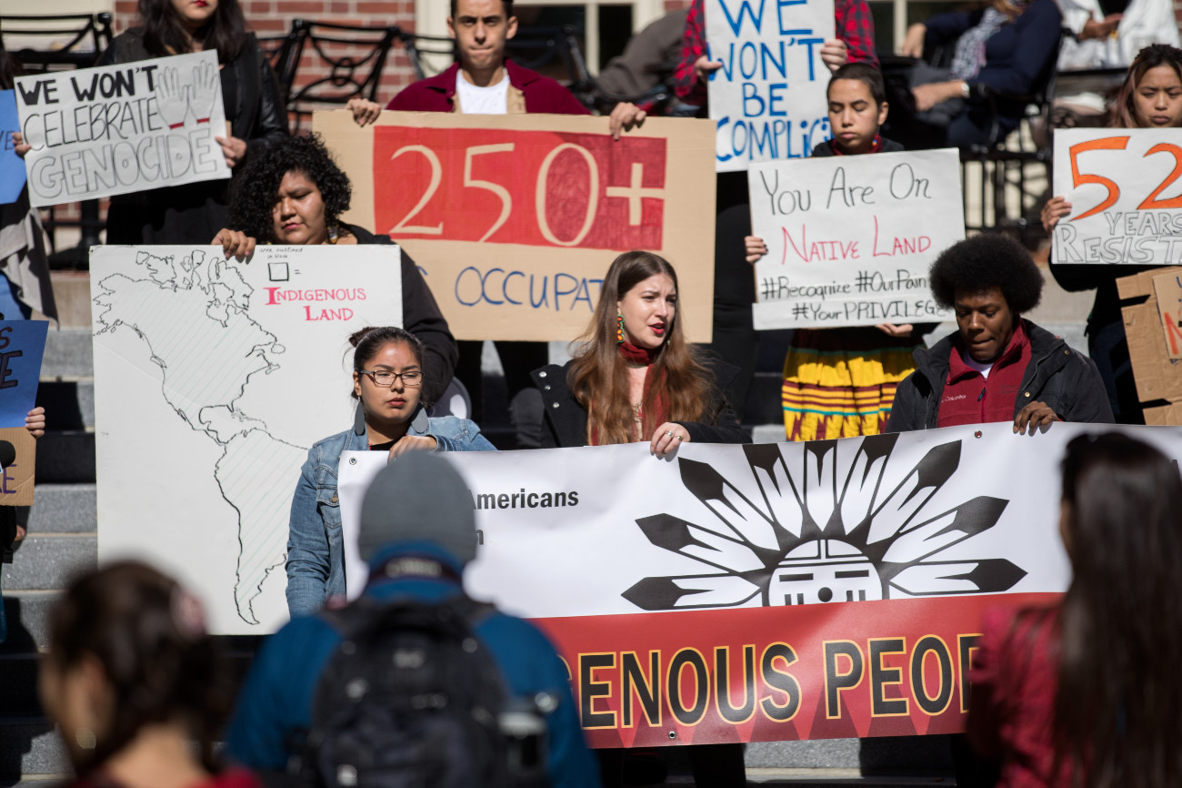 Protesters holding signs