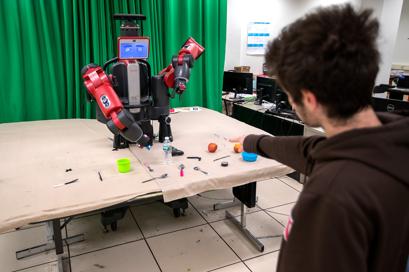 Eric Rosen interacting with the robot