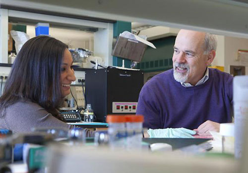 Jeffrey Morgan talking with colleague Jacquelyn Schell