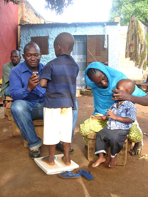 Health care worker with children in Mali