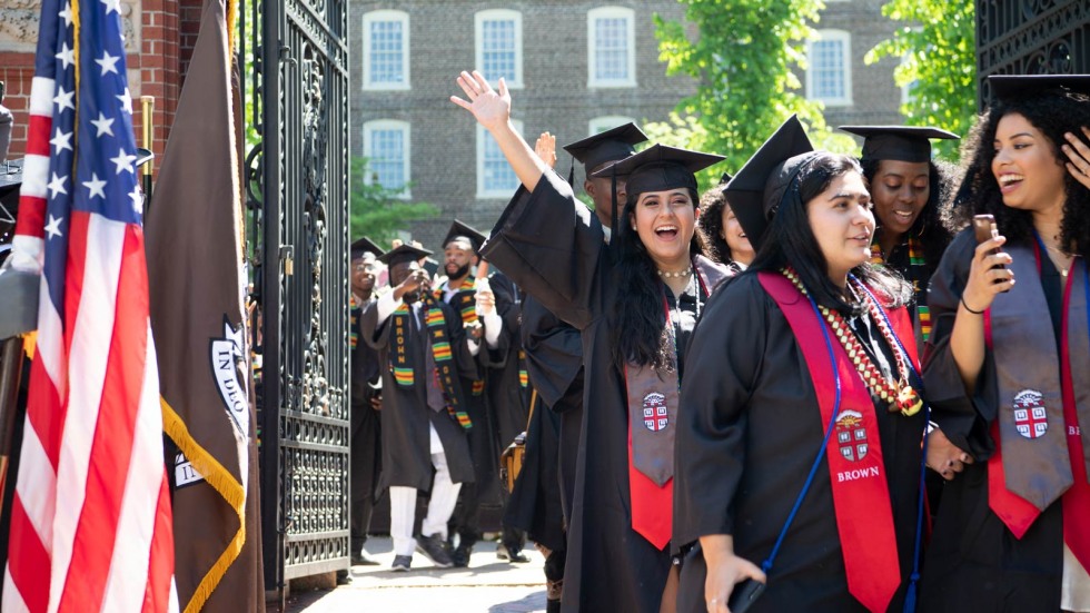 Brown graduates near Van Wickle Gates