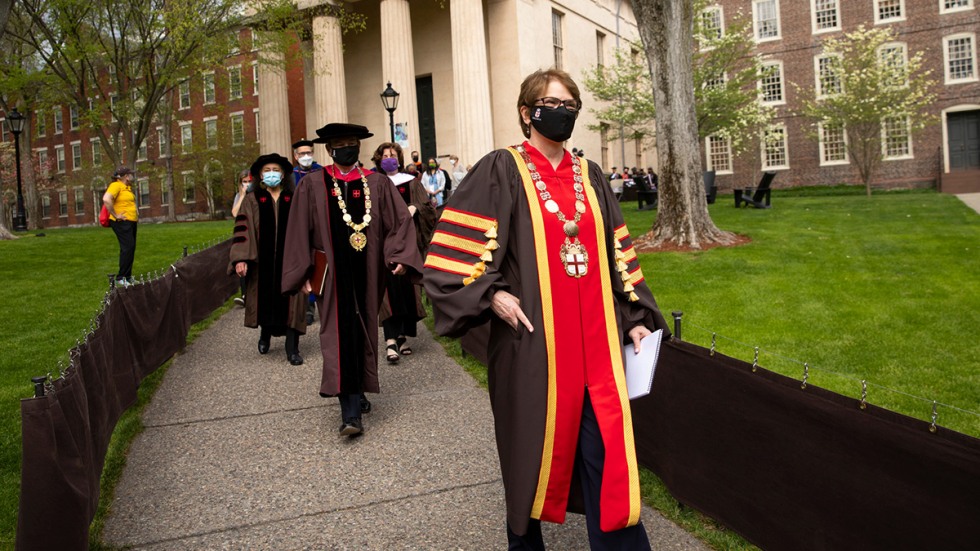 Image of Christina Paxson leading the procession to the Van Wickle Gates