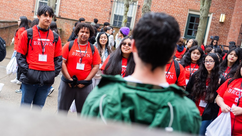 students smiling at a tour guide