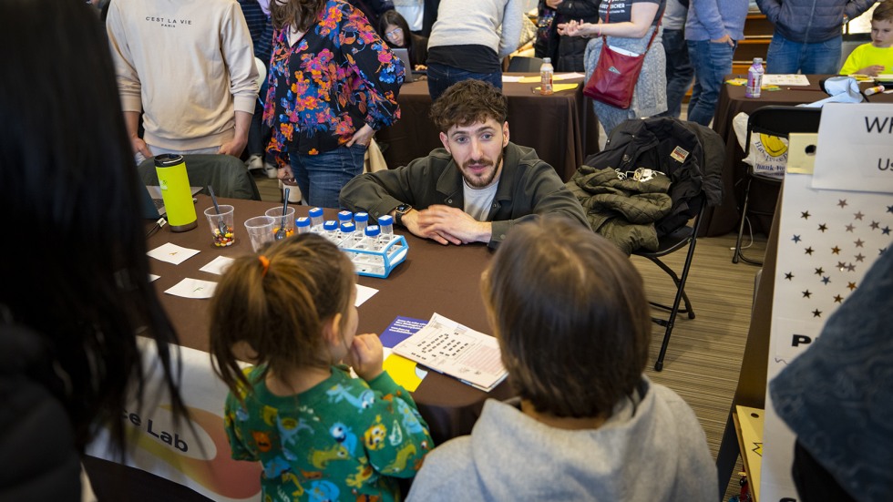 young kids take a smell test at brain fair 