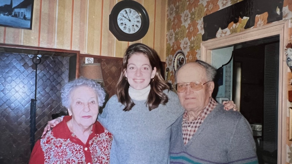 student stands with older folks