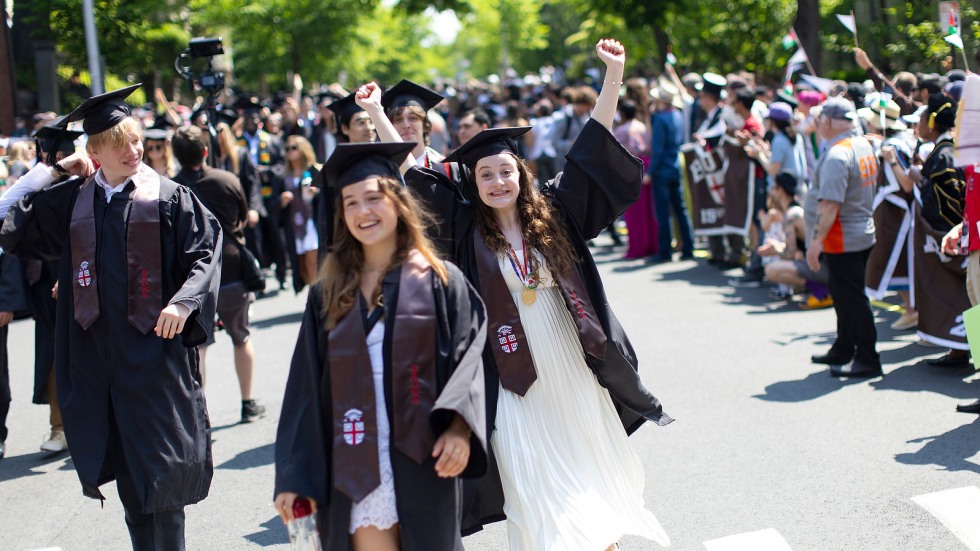 Student raising arms