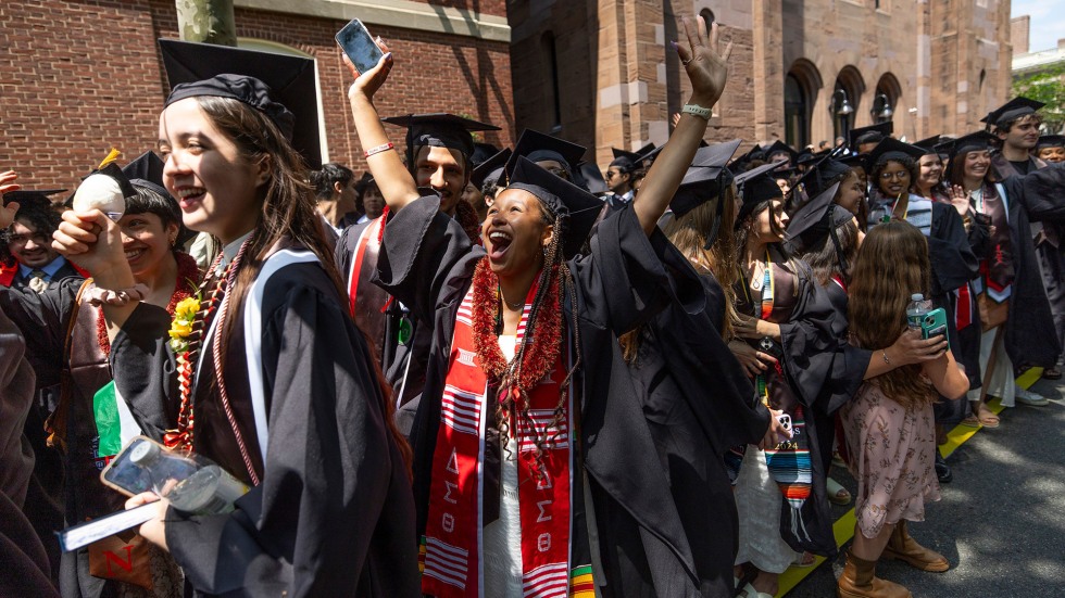 Student raising arms