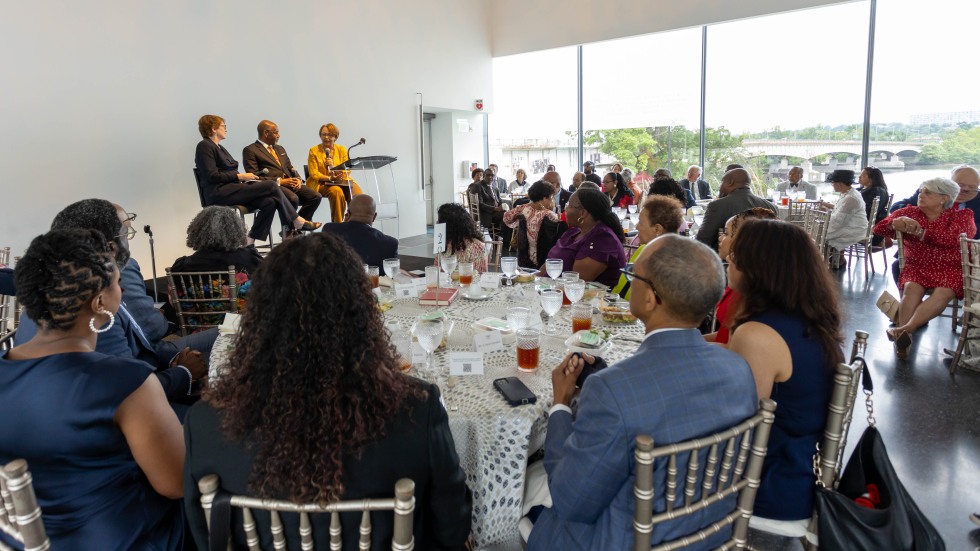 attendees gathered at tables