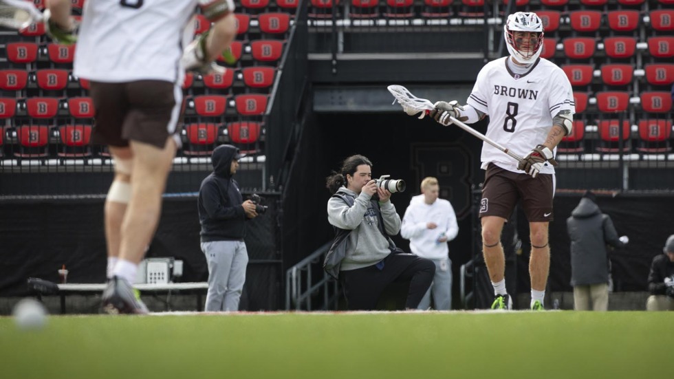 Providence high schooler taking photos of Men's Lacrosse team at Brown