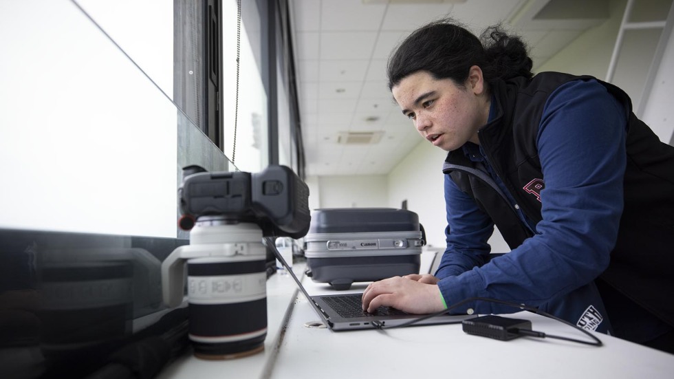 Providence high schooler taking photos of Men's Lacrosse team at Brown