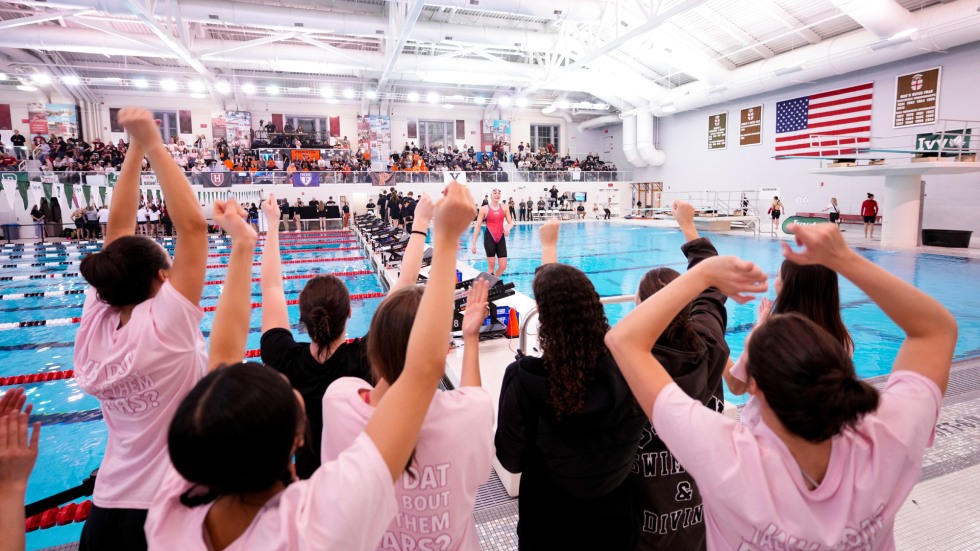 Women's swim team cheers after Zehra's win