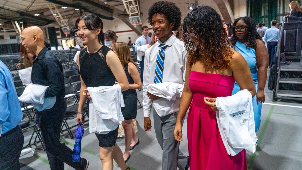 medical students walking with white coats