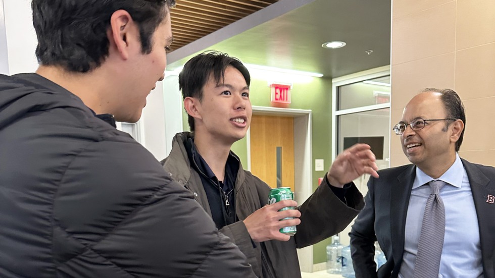 Dean of Medicine and Biological Sciences Mukesh Jain chats with students