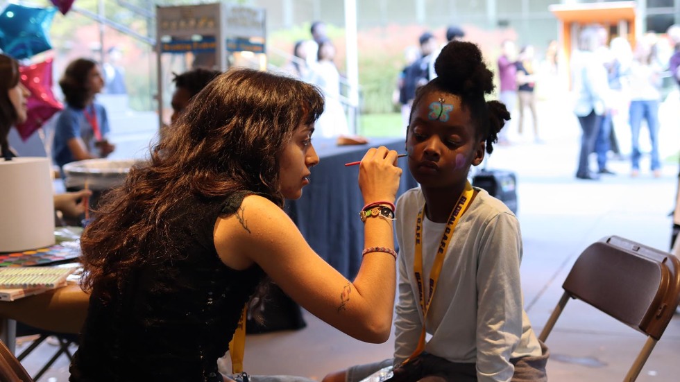 kids get face painted at celebration event