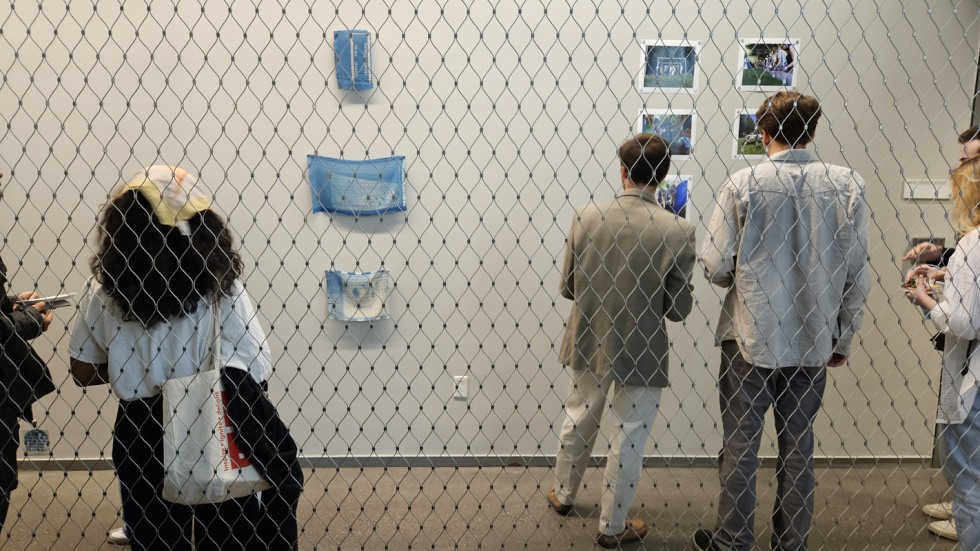 Attendees look at exhibit at reception