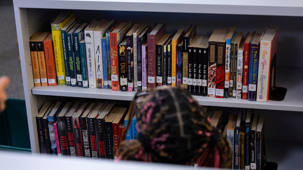 bookshelves stocked with hundreds of new books