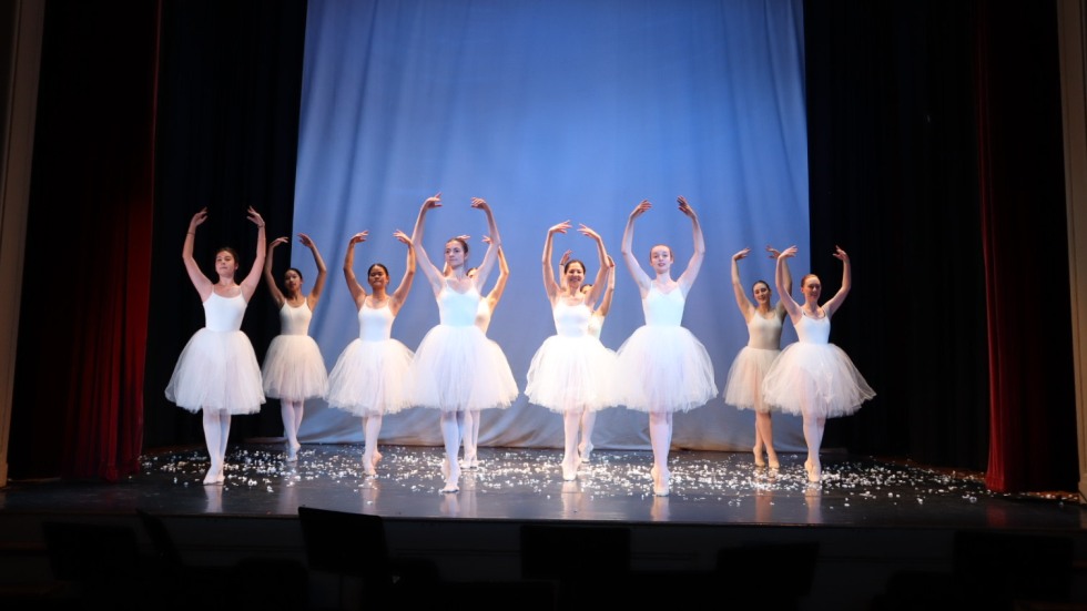 Sugarplum fairies dance in matching white sparkly costumes