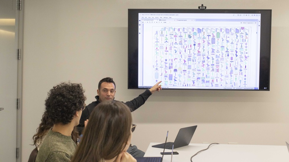 Students and instructor at a meeting 