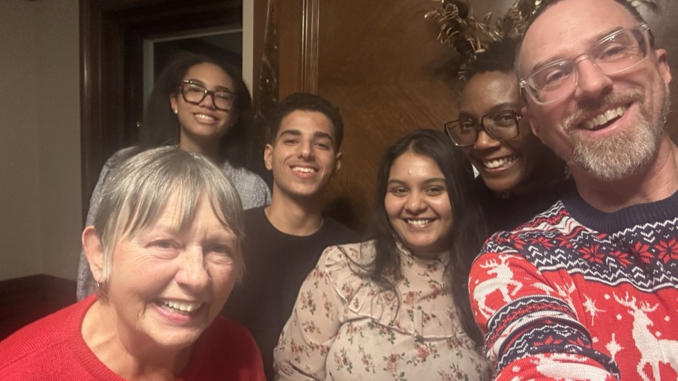 six people pose for a selfie