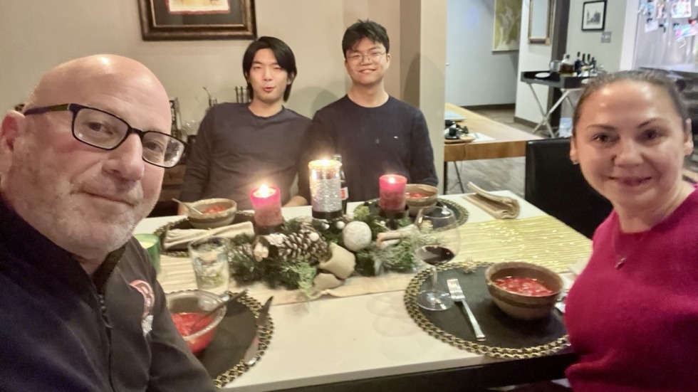 four people around a dinner table