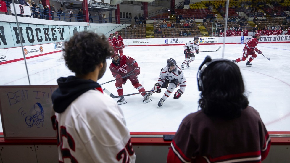 Band members watch hockey game 